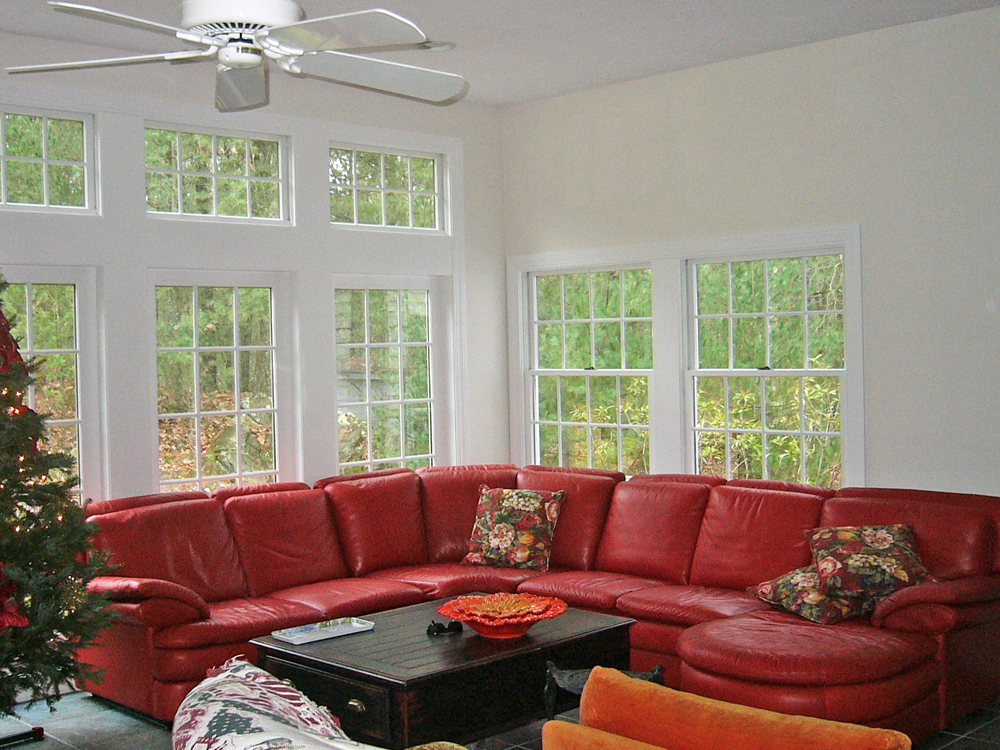 couch in front of high windows