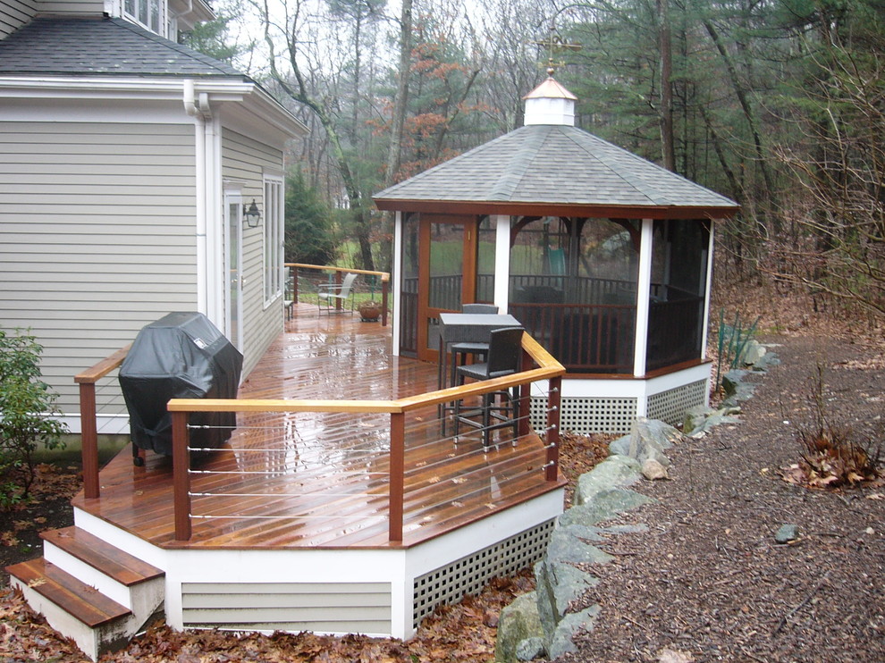 A gazebo on the deck is so smart during those sticky, mosquitoed nights! The gazebo fits in perfectly with the space - with a matching roof and wood work. 