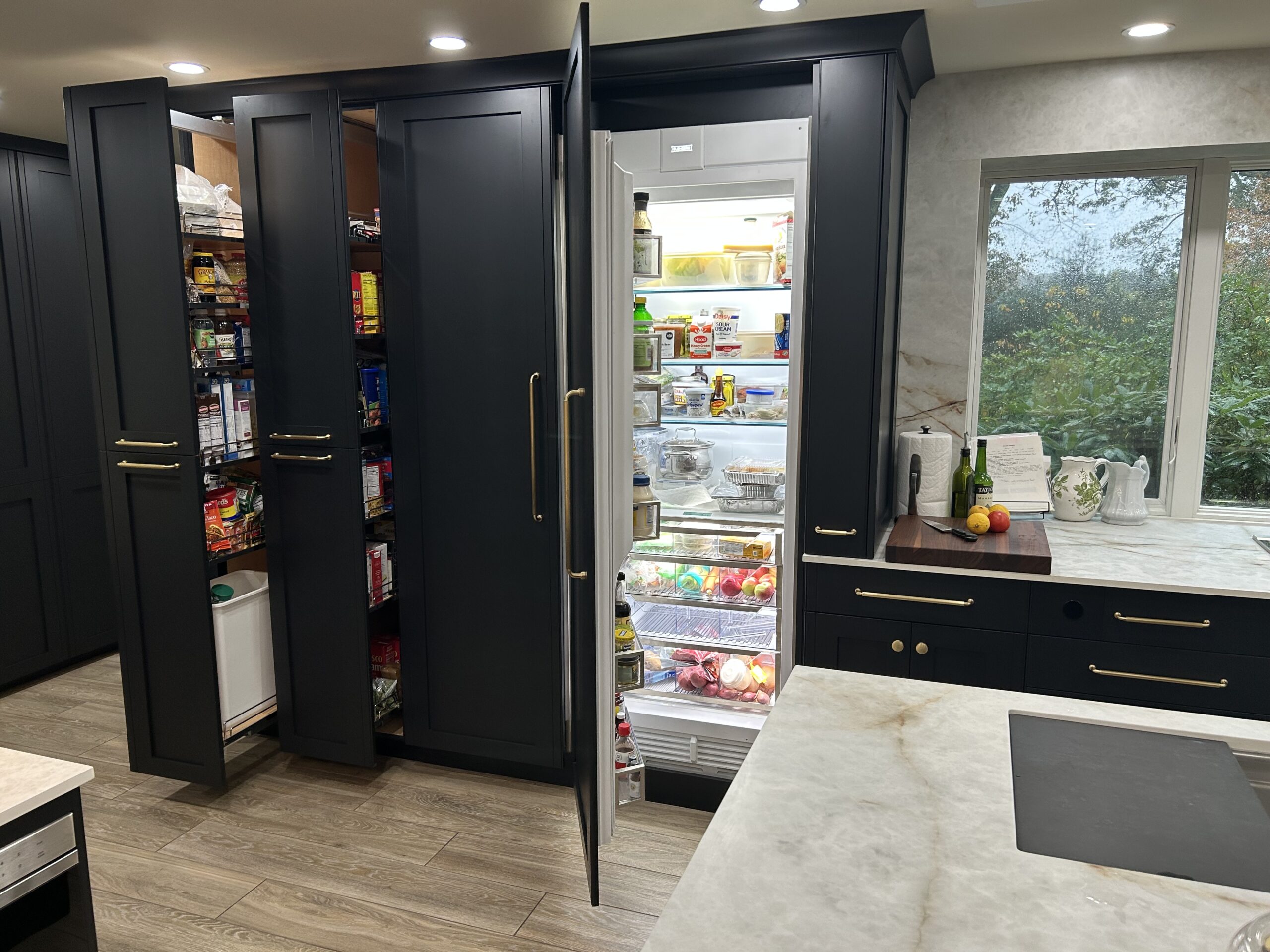 The hidden refrigerator and pull out shelves hide the food,